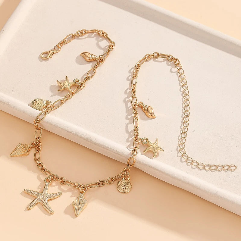 Halsband med snäcka och sjöstjärna